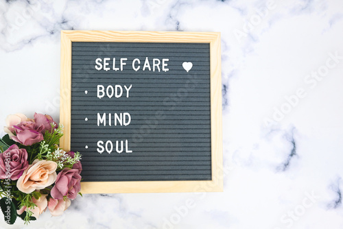 фотографія Letter board with phrase Self care, body, mind, soul with heart