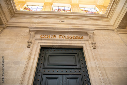 cour d'assises sign text on ancient wall interior building means in french assize court justice photo