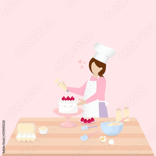 Women decorate cake on the table 