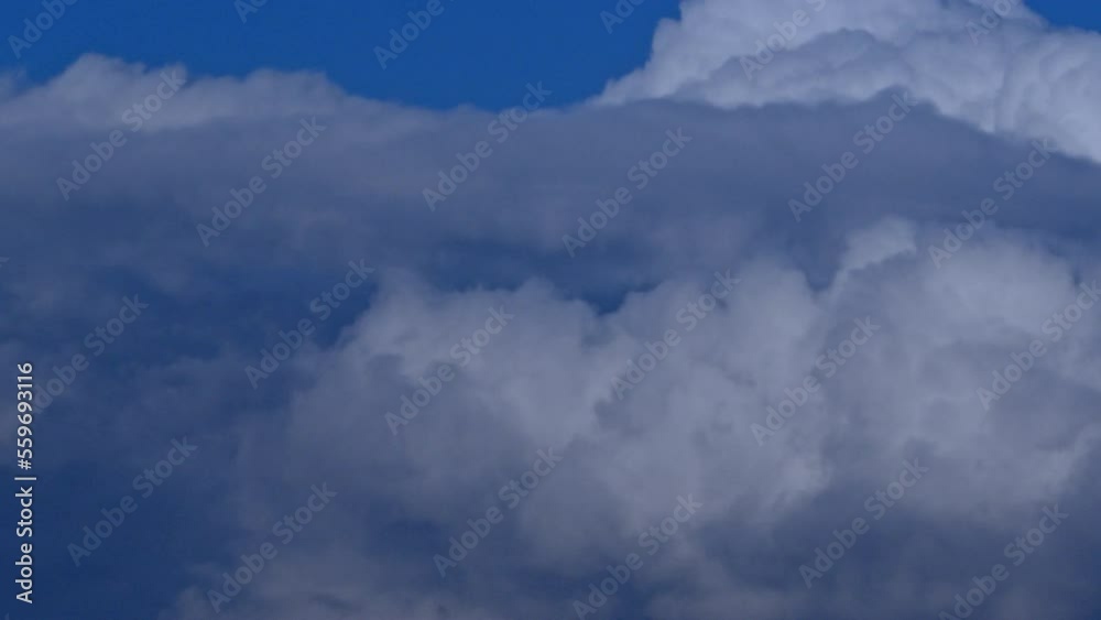 Blue clouds against the sky. Beautiful sky background with clouds. A time lapse of a cloudy sky Blue clouds against the sky. Beautiful sky background with clouds. A time lapse of a cloudy sky
