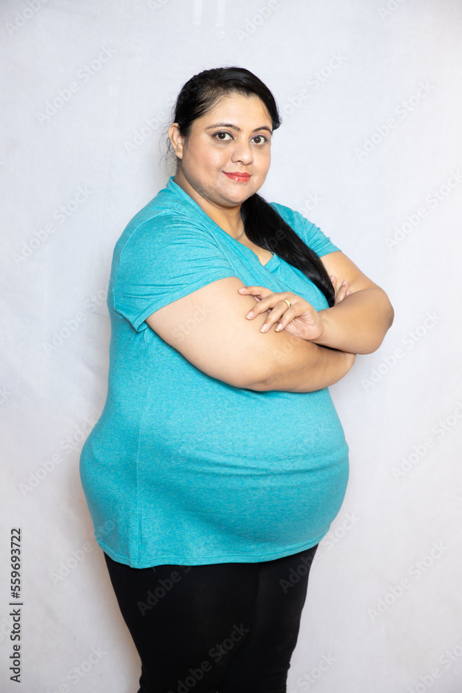 Fat Indian Woman Standing With Cross Arm Standing Isolated Over White 