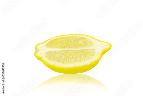 A slice of ripe lemon isolated on a white background. Citrus fruits.