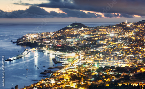 Fototapeta Naklejka Na Ścianę i Meble -  Portugal island Madeira at night with city Funchal, Panorama