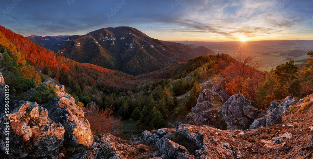 Fototapeta premium Beautiful sunset over autumn forest with big mountain panorama landscape in Slovakia