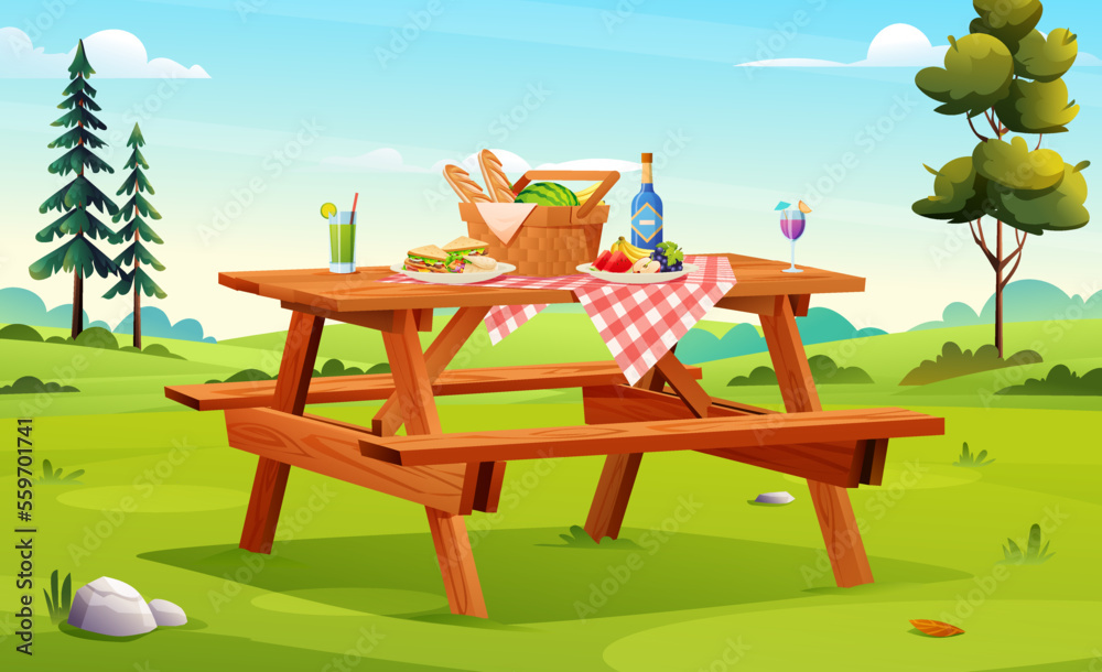 Picnic setup composed of basket with food, fruits, sandwiches on the