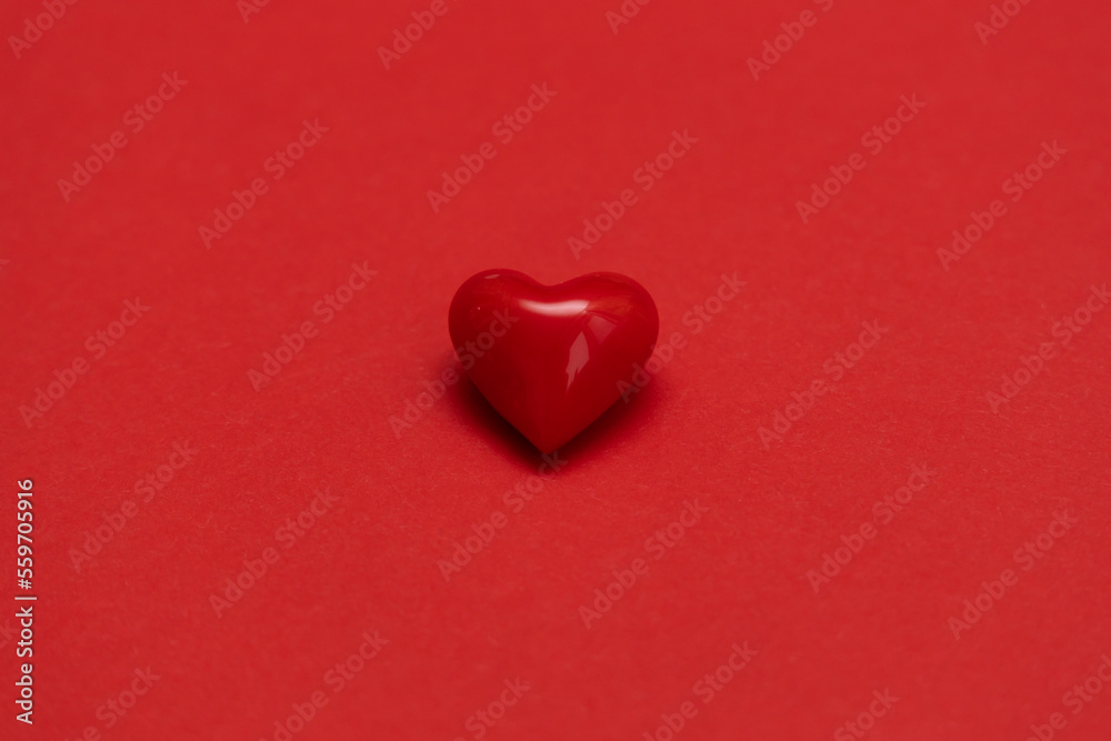 Valentines day red heart on same color background. Monochromatic vivid color. Valentine's day concept. Close up, copy space. Valentines day red heart on same color background. Monochromatic vivid color. Valentine's day concept. Close up, copy space.