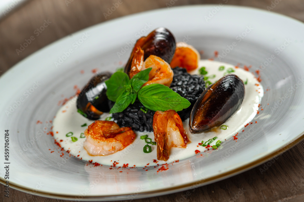 seafood, mussels, salmon on a white plate seafood, mussels, salmon on a white plate
