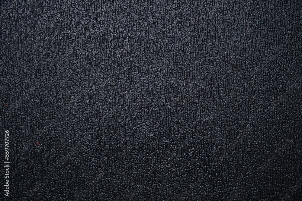 The texture of the black plastic ribbed surface for background The texture of the black plastic ribbed surface for background
