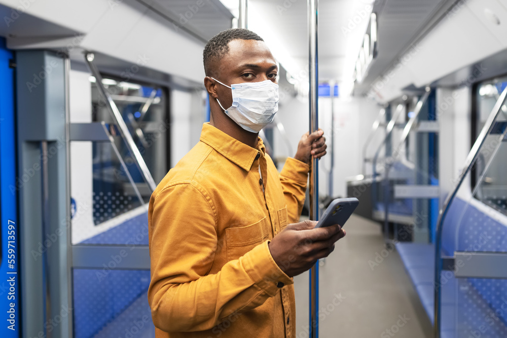 Portrait of a man in a protective mask in a subway car Portrait of a man in a protective mask in a subway car