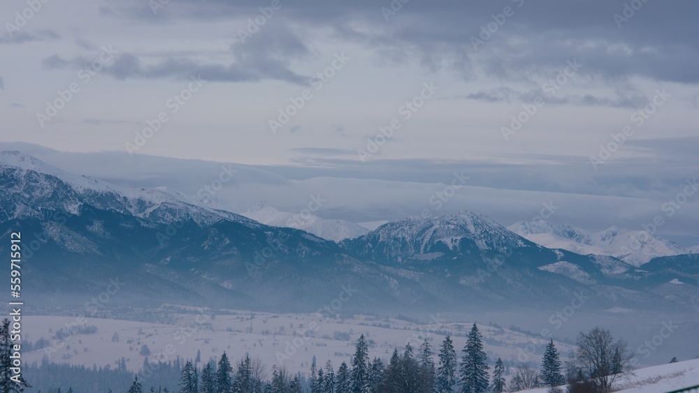 FIXED Establishing shot, view of beautiful Tatra mountain range on a Poland and Slovakia border before sunrise FIXED Establishing shot, view of beautiful Tatra mountain range on a Poland and Slovakia border before sunrise
