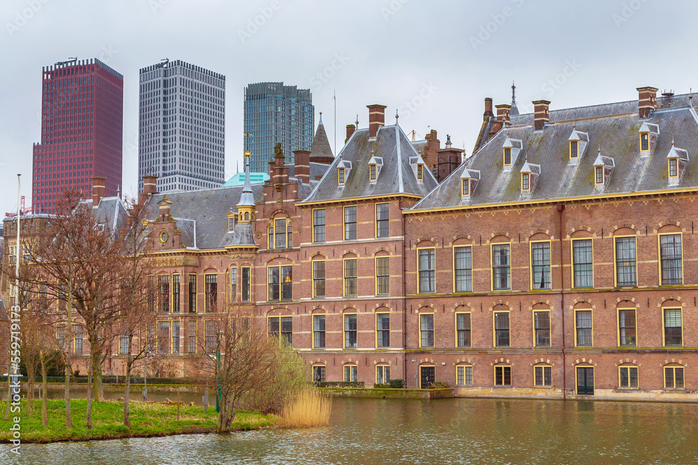 Hague, Netherlands modern office buildings behind the Mauritshuis museum and the Binnenhof parliament, Hofvijver lake