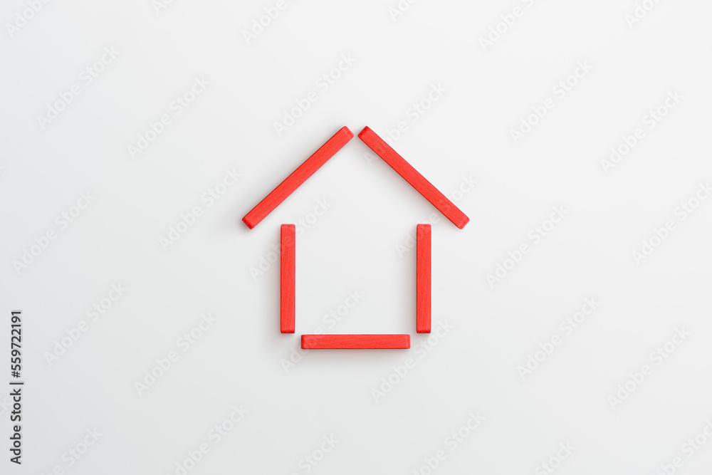 Red wooden house frame on white background. family home, real estate Red wooden house frame on white background. family home, real estate