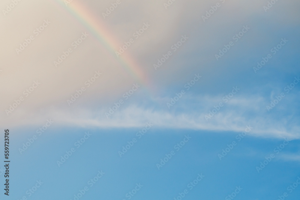 clear sky rainbow background fluffy white clouds