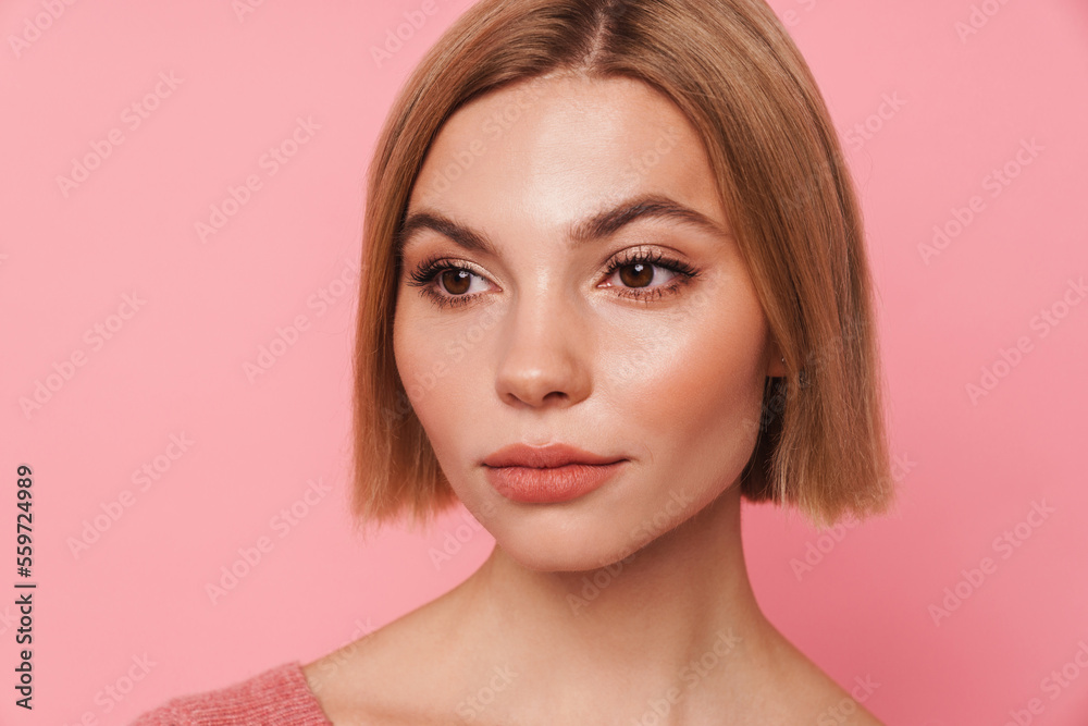 Young blonde woman with short hair looking aside Young blonde woman with short hair looking aside