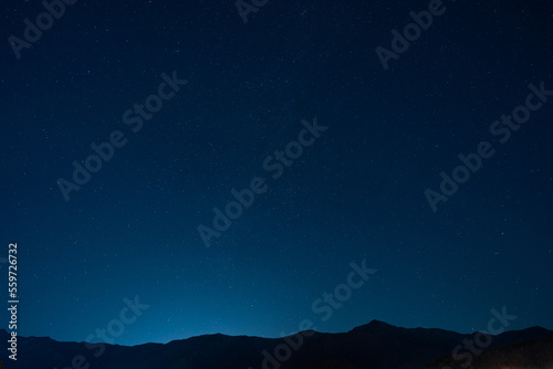 Many stars in the vast sky above the mountains © LuLight