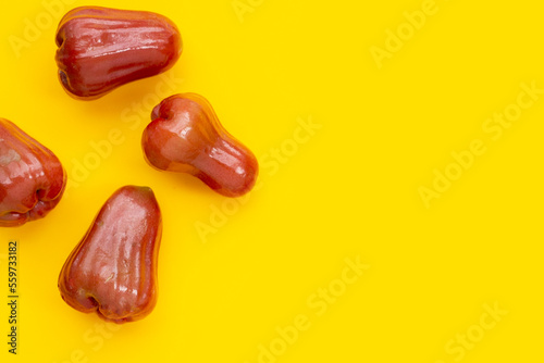 Fresh rose apple on yellow background.