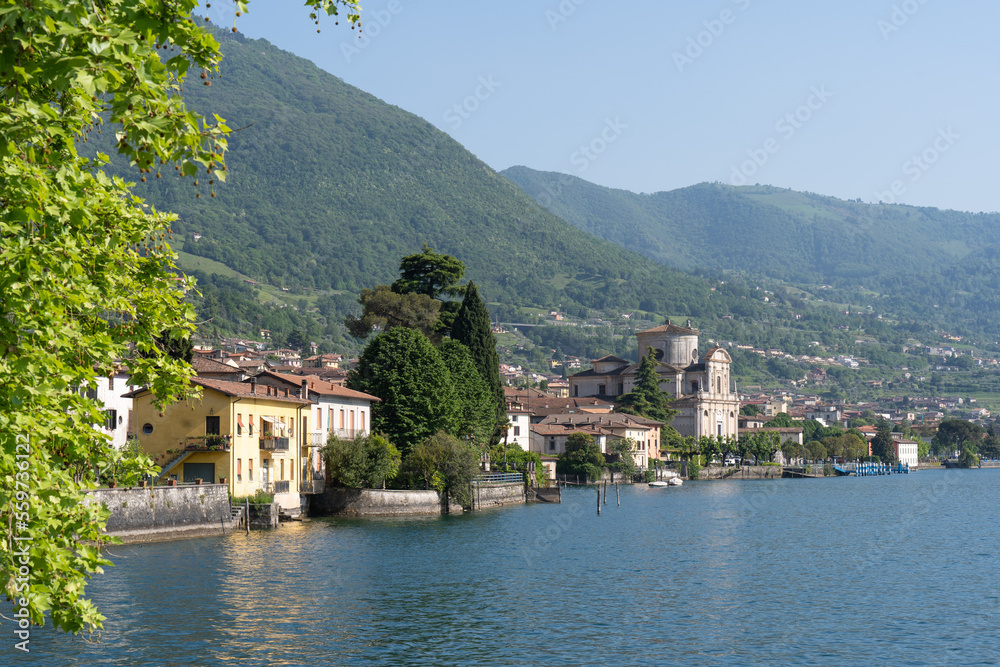 Village on the shore of Lago d'Iseo in Italy. Lago d'Iseo is a lake in the Lombardy region, surrounded by mountains and hills. 