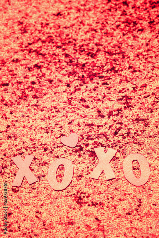 The inscription xo xo, glitter and hearts on a pink background. The inscription xo xo, glitter and hearts on a pink background.