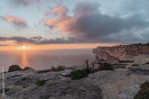 Sunset in Gozo with a view over the beautiful cliffs. 