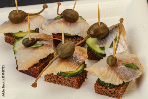 Herring fillet canape with caperberry