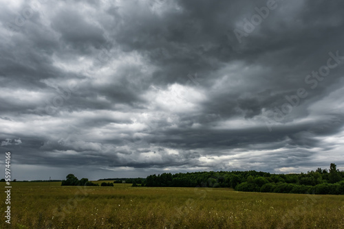 panorama of black sky background with storm clouds. thunder front may use for sky replacement