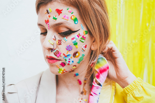 Woman with make-up and stickers on face photo