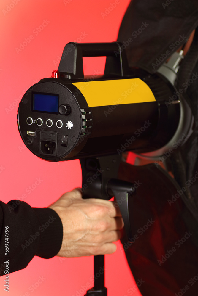 Fototapeta premium studio flash with softbox on tripod with back