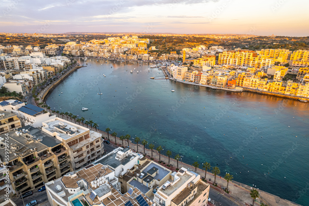 Marsaskala village and seascape, Malta at sunrise. Aerial Drone view