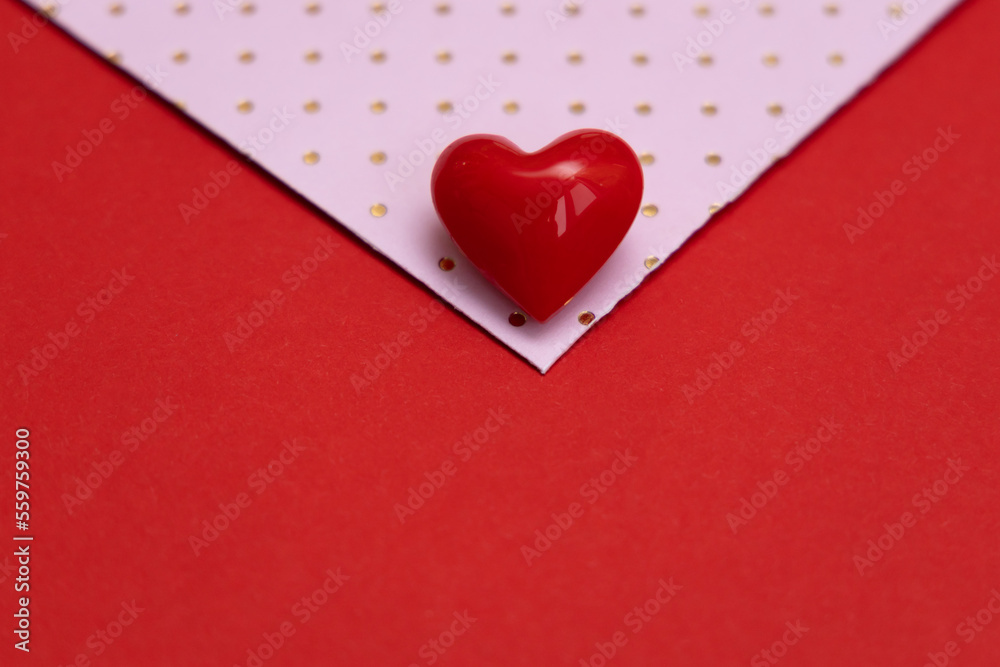 Valentines day red heart on pink dots envelope. Vivid color. Valentine's day concept. Copy space. Space for text.