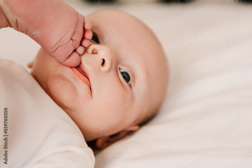 Little funny cute boy, child sucking finger on leg, baby lying on bed, pulling leg into mouth. Playful toddler with bulging eyes having fun, making faces grimaces. Happy childhood, family concept
Little funny cute boy, child sucking finger on leg, baby lying on bed, pulling leg into mouth. Playful toddler with bulging eyes having fun, making faces grimaces. Happy childhood, family concept