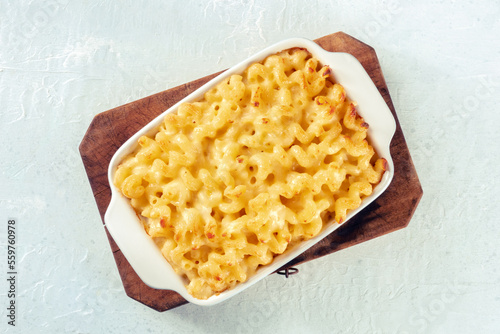 Macaroni and cheese pasta in a casserole, shot from the top. Cheesy American gratin dish, baked in the oven