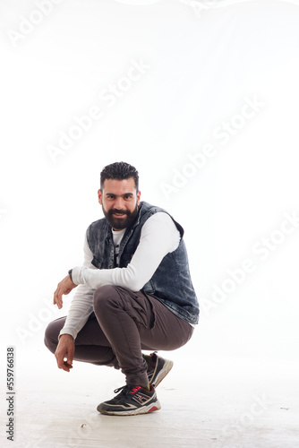 elegant man with beard  in casual wear with face reaction photo