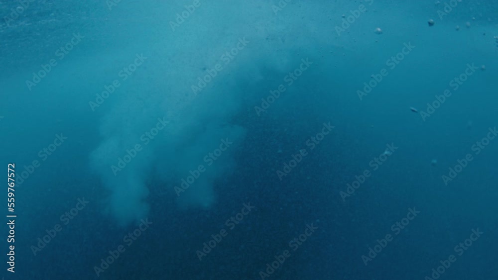 Crystal clear ocean wave breaks on the shore in the Maldives Crystal clear ocean wave breaks on the shore in the Maldives