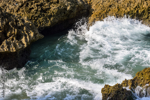 Waves crashing into rock on the shore