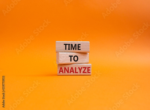Time to Analyze symbol. Concept word Time to Analyze on wooden blocks. Beautiful orange background. Business and Time to Analyze concept. Copy space