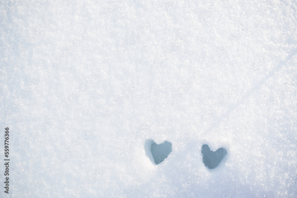 pair of hearts made of snow . winter background for valentine's day
