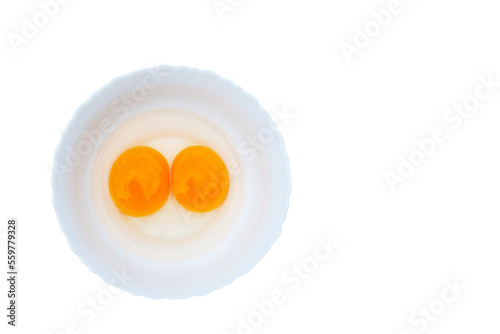 Egg with two yolks in white plate isolated on transparent background png file