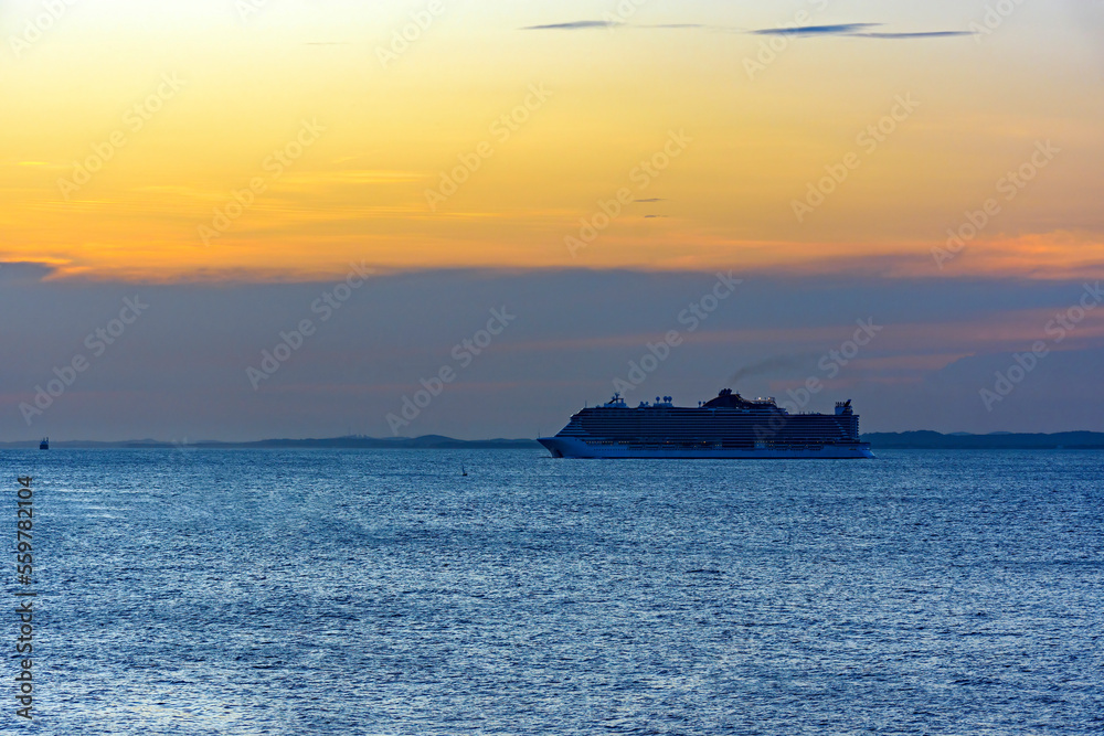 Stunning luxury ship arriving in the city of Salvador in Bahia during summer sunset