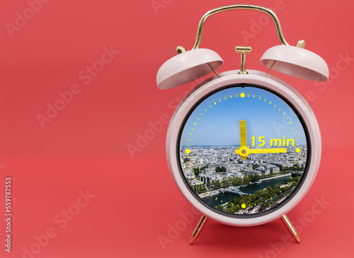Vászonkép Ringing twin bell vintage classic alarm clock Isolated on red and with the 15 minute city concept