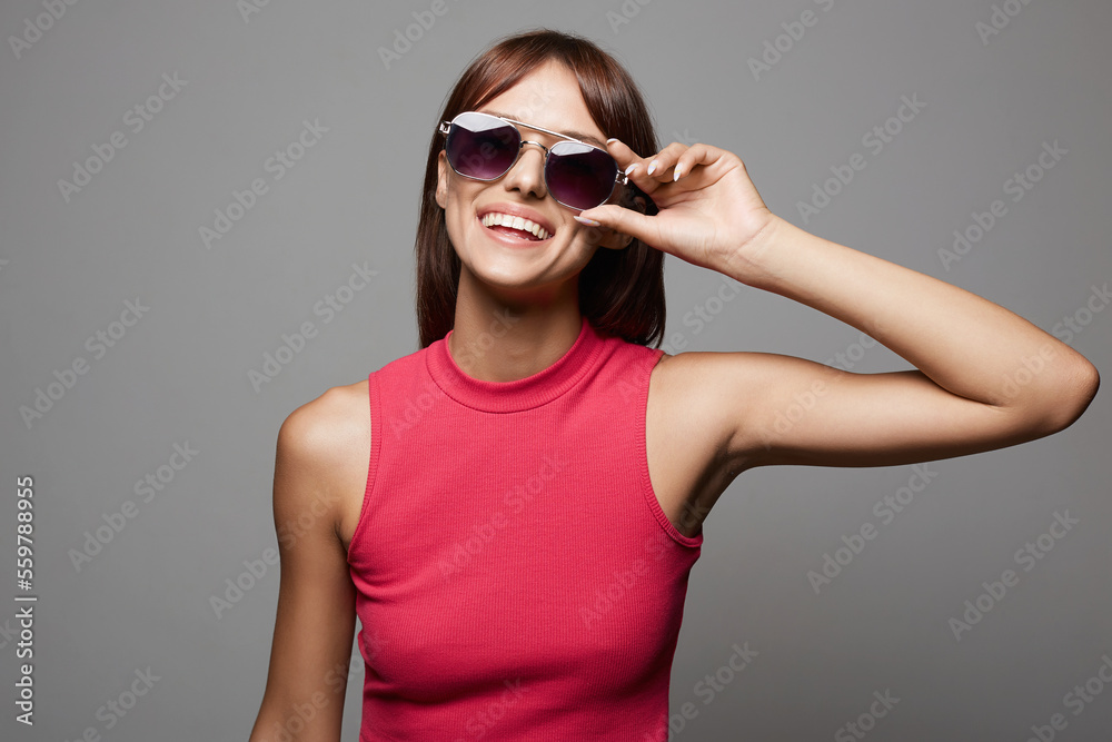 Fototapeta premium Happy beautiful Girl in Sunglasses. Smiling young woman
