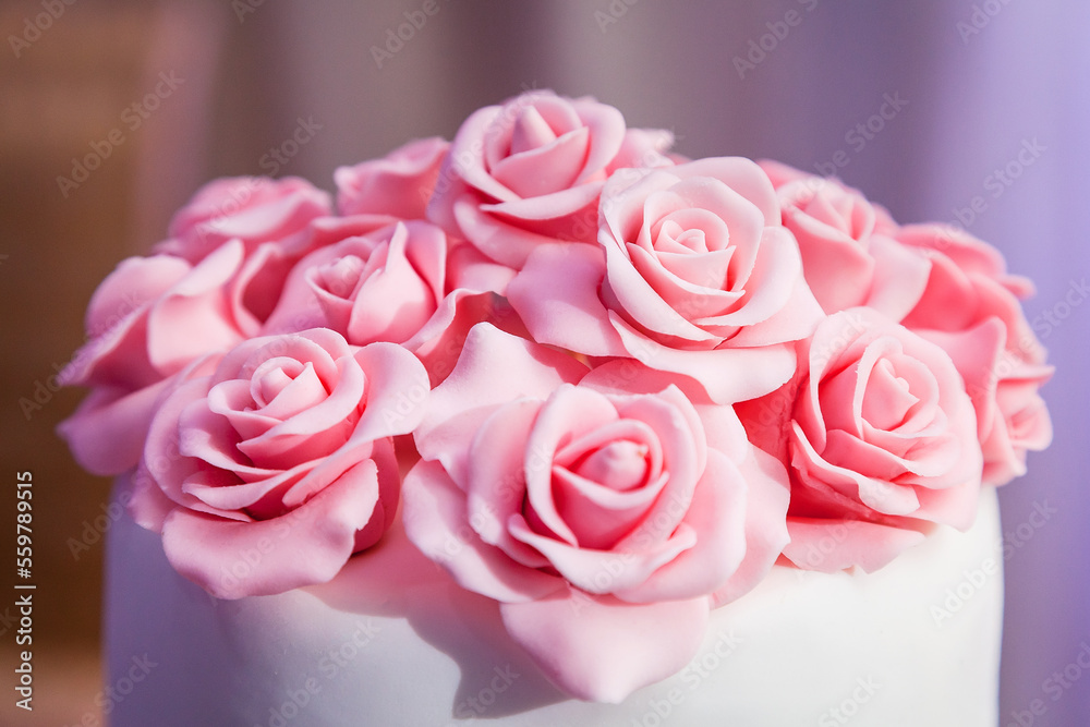 pink roses from mastic close-up - decoration on the wedding cake pink roses from mastic close-up - decoration on the wedding cake