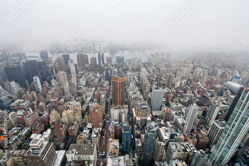 New York, Manhattan, October 1, 2022: The cloudy view of Midtown Manhattan, the East River and Brooklyn on an overcast day.