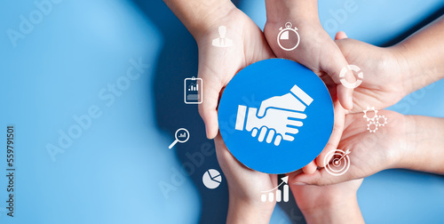 Papier peint Business hands holding handshake icon, creative and set up business objective target goal, marketing solution, target for business investment