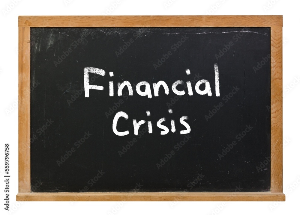 Financial crisis written in white chalk on a black chalkboard isolated on white Financial crisis written in white chalk on a black chalkboard isolated on white