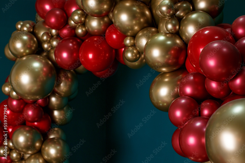 Arch of red and bronze balls on a green background Arch of red and bronze balls on a green background