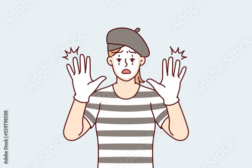 Funny woman clown with white face entertains people by acting as mime and leaning on invisible glass. Girl theater or circus actor stretches out palms to screen to cheer people up. Flat vector design 