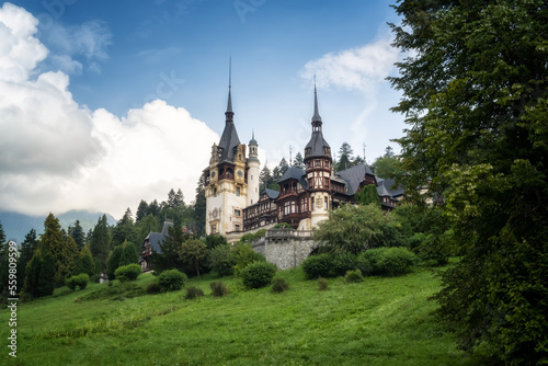 Amazing panoramic picture of the beautiful Peles Castle and its beautiful gardens near Sinaia, Romania.