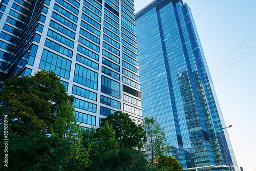 Detail of glass office building facade with reflections. Modern city architecture