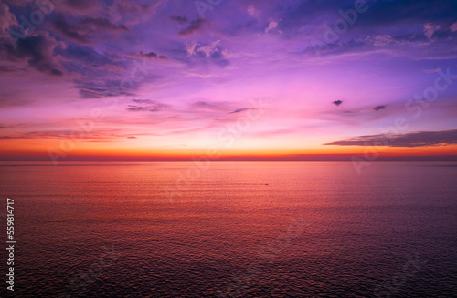 Fototapeta Naklejka Na Ścianę i Meble -  Aerial view sunset sky, Nature beautiful Light Sunset or sunrise over sea, Colorful dramatic majestic scenery Sky with Amazing clouds and waves in sunset sky purple light cloud background