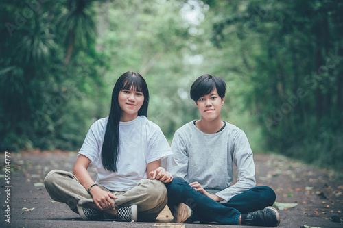 Couple of girl with girl,LGBT Pride month concept,Asian Handsome male make up and wear woman cloth,Gay Freedom Day,Portrait of Non-binary on white background photo